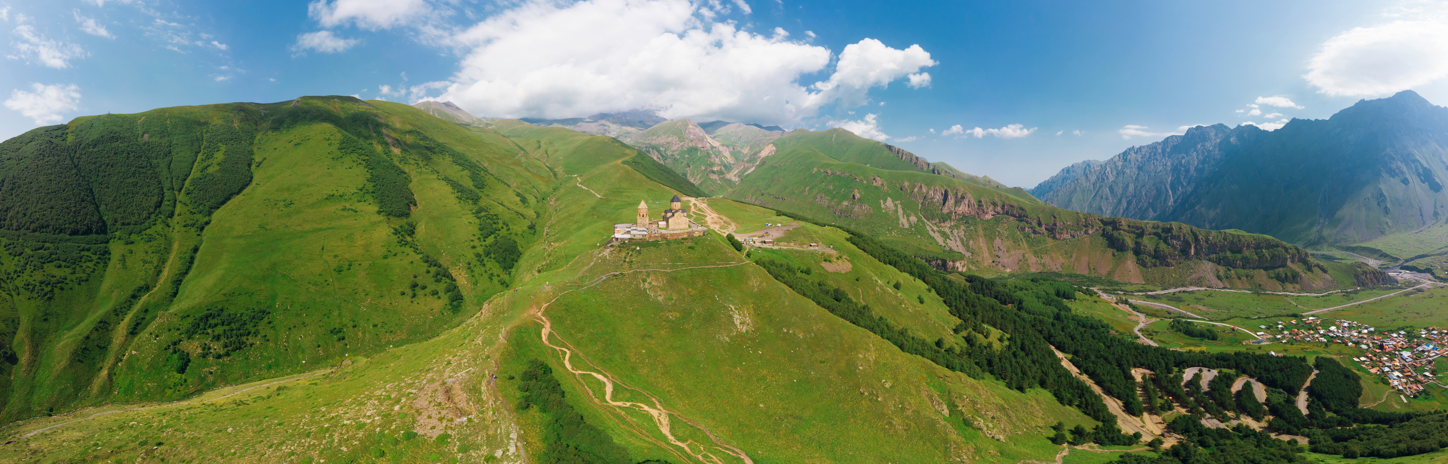 aerial view of Caucasus mountain with Trinity Church of Gergeti